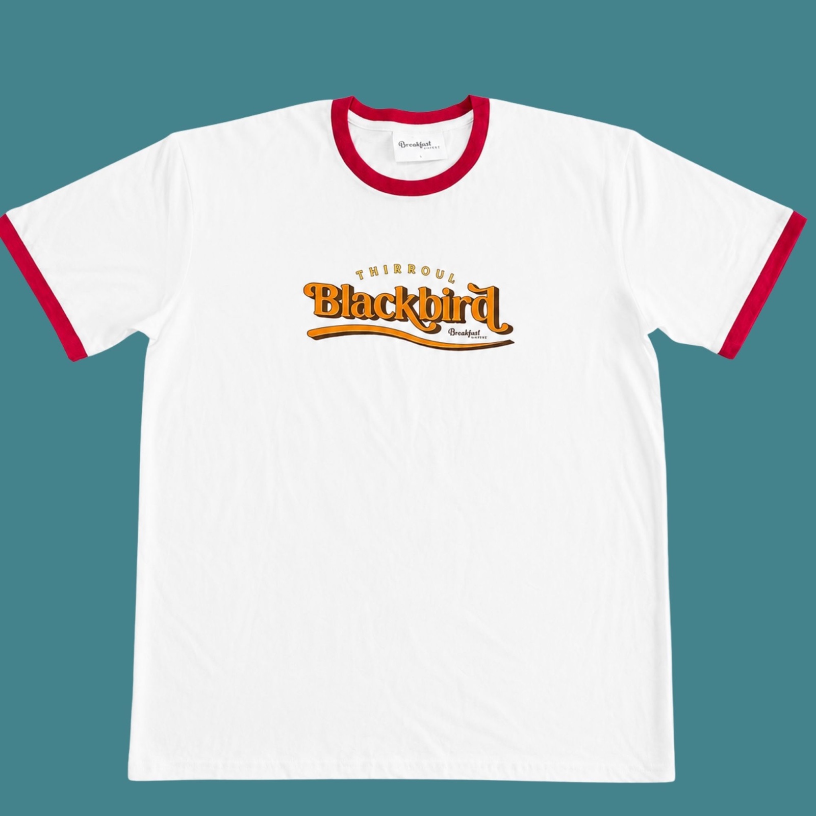 White Blackbird T-shirt with red neckline and sleeve trim